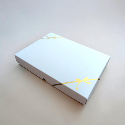 White Gift Box With Gold Bow Detail